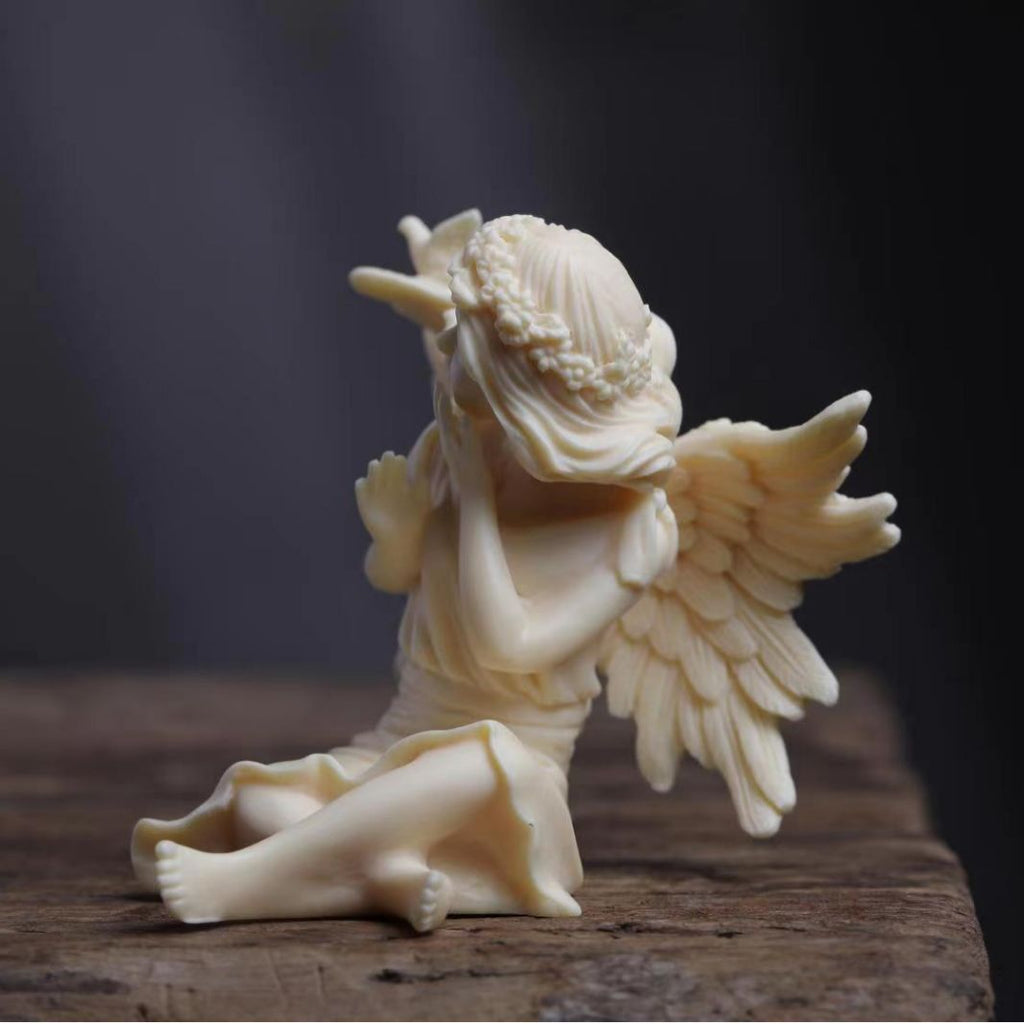 Vegetable ivory angel girl ornament with bird and feather wing details