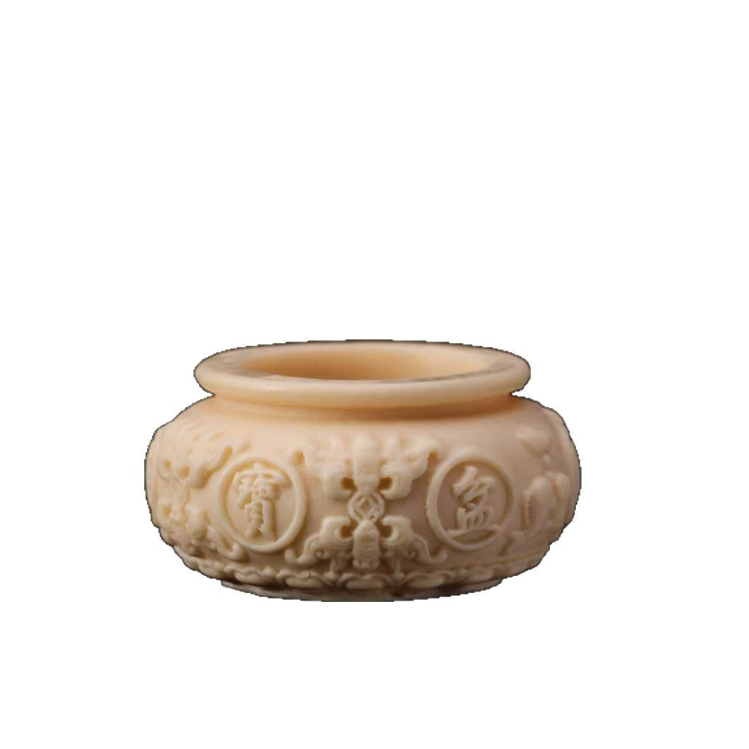 Ivory nut cicada ornament in botanical vegetable ivory material with natural tonal variation