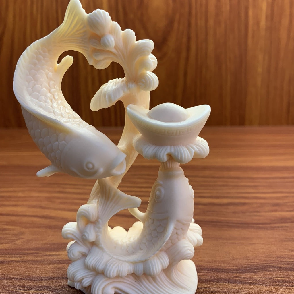 Hand-carved ivory nut double-fish treasure ornament with yuanbao motif