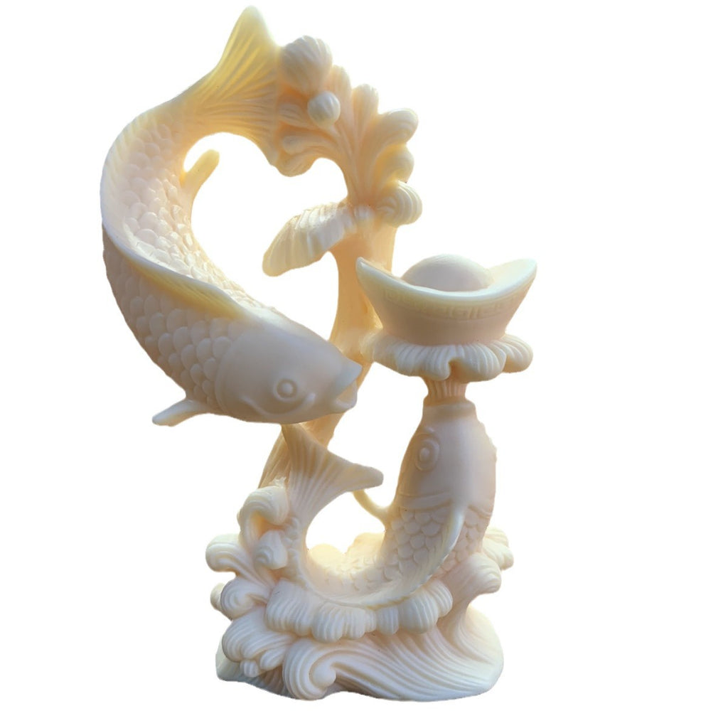 Ivory nut double-fish treasure ornament isolated on white background