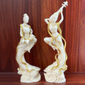 Ivory nut Dunhuang flying apsara musician pair with gold-tone accents, pipa and drum figures