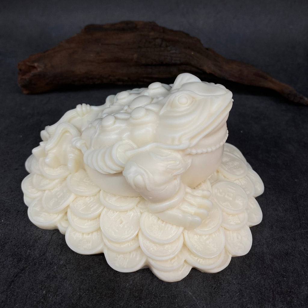 Ivory nut golden toad wealth figurine on Chinese coin base in natural creamy vegetable ivory tone
