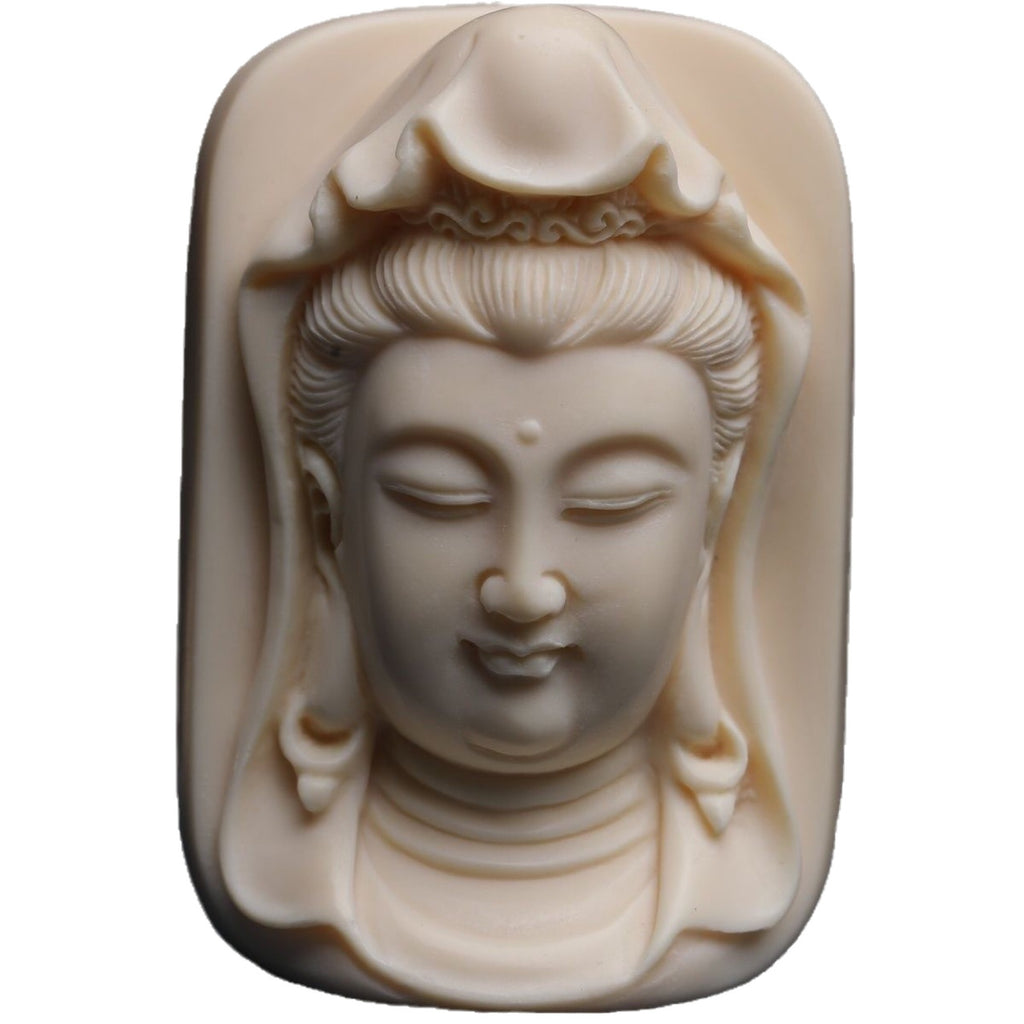 Front view of hand-carved Guanyin relief made from ivory nut vegetable ivory