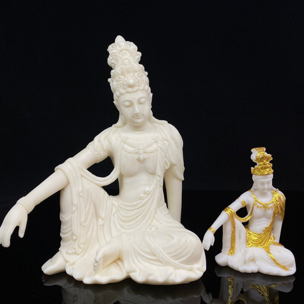 Ivory nut seated Guanyin decorative statue with detailed carved robes and serene expression