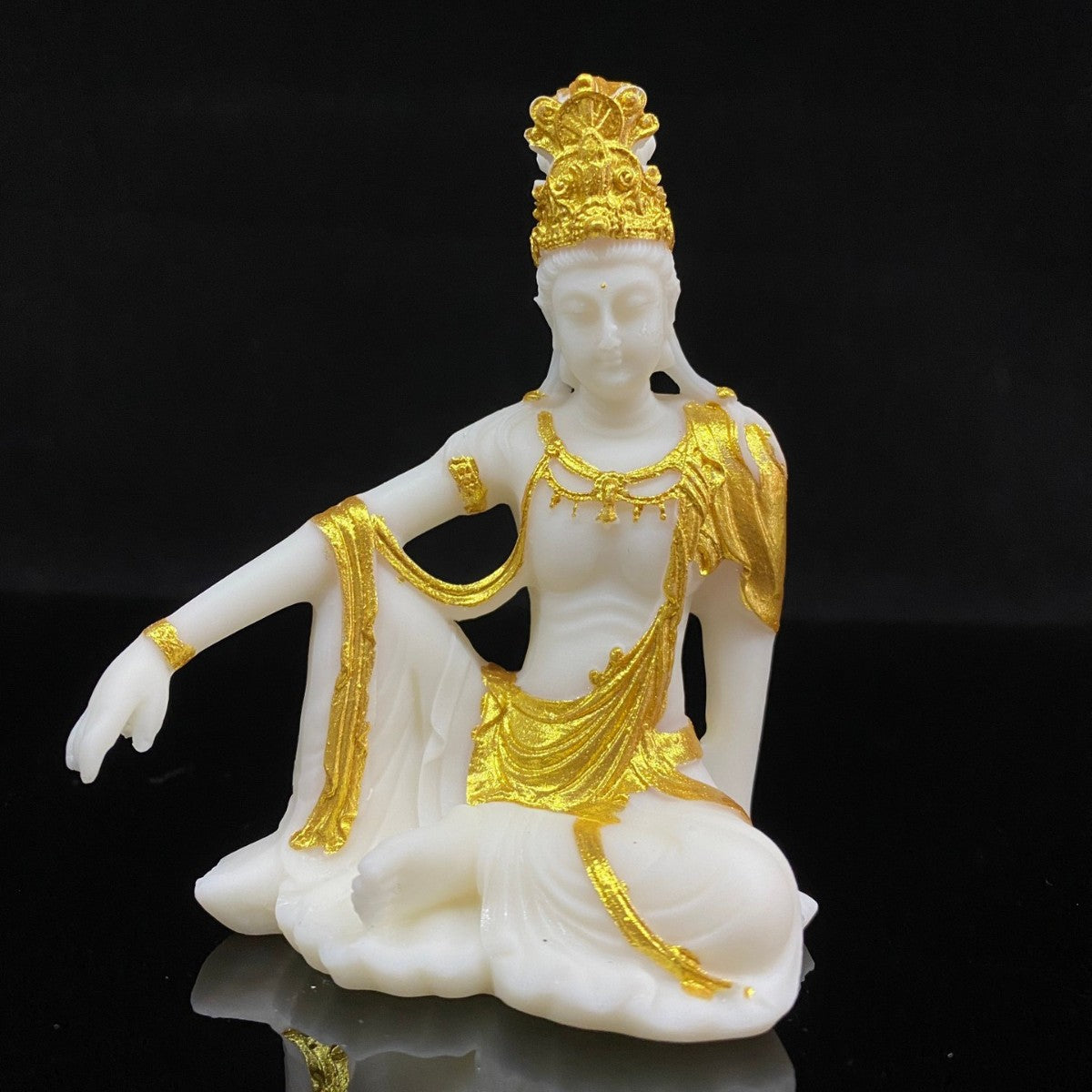 Ivory nut seated Guanyin statue with hand-applied gold-tone detailing, small size approximately 11cm