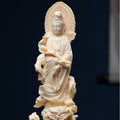 Ivory nut Guanyin statue with dragon base, ruyi-like form and halo in creamy vegetable ivory tone