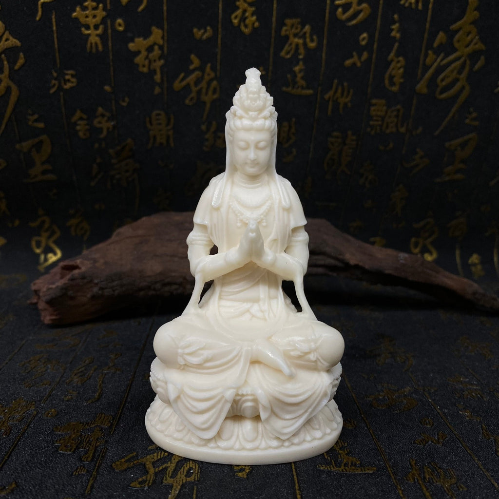 Ivory nut seated Guanyin statue with prayer mudra on lotus pedestal in natural creamy finish