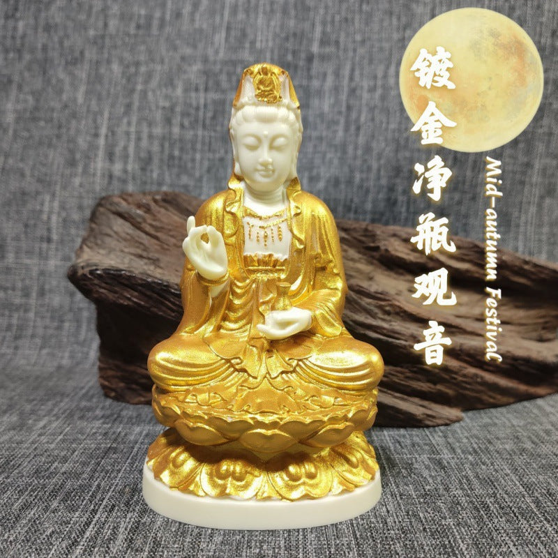 Ivory nut Jingping Guanyin statue with gold-tone accents on lotus throne