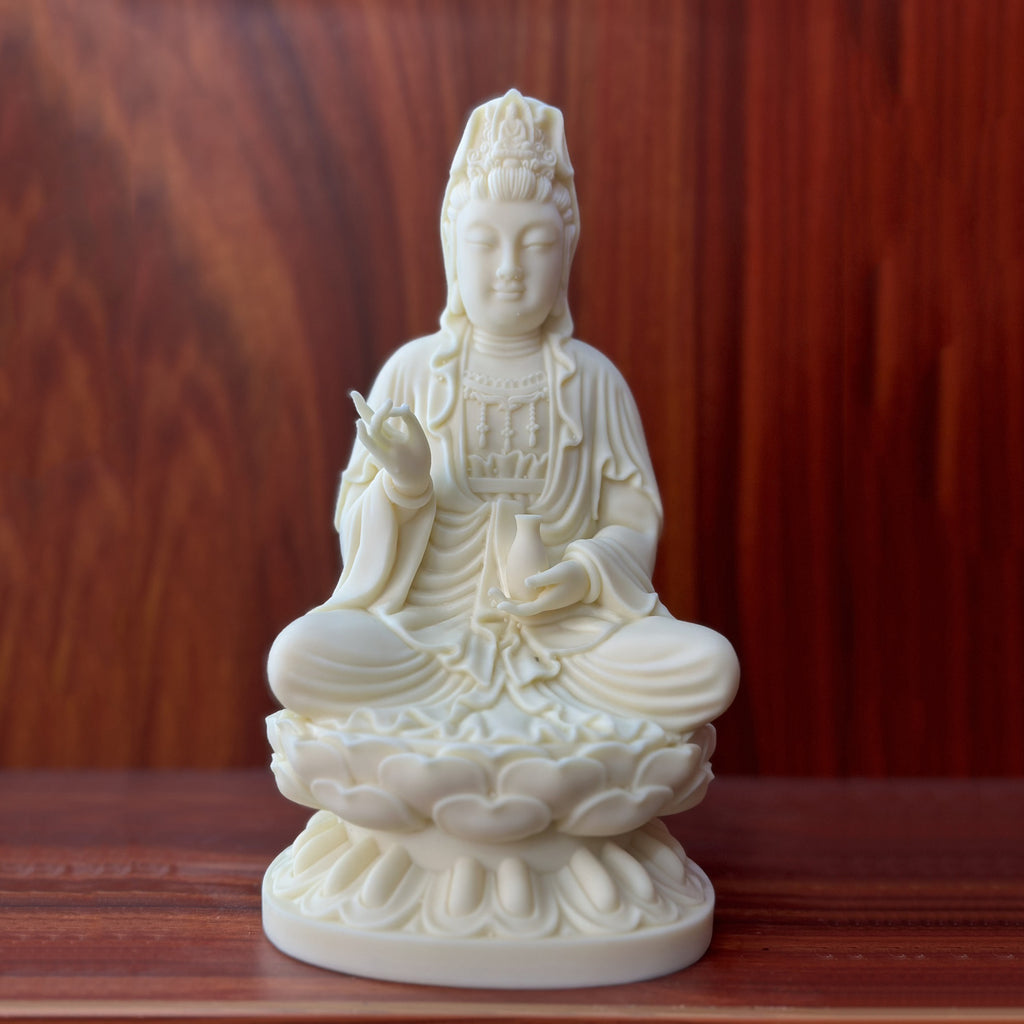 Ivory nut Jingping Guanyin seated on lotus throne in natural creamy finish