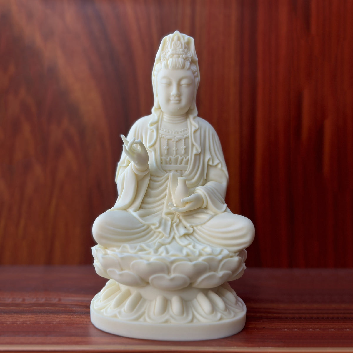 Ivory nut Jingping Guanyin seated on lotus throne in natural creamy finish