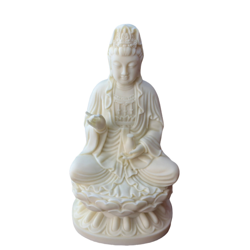 Natural ivory nut Jingping Guanyin decorative statue on white background
