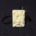 Hand-carved ivory nut multi-dragon fortune motif pendant with dark cord