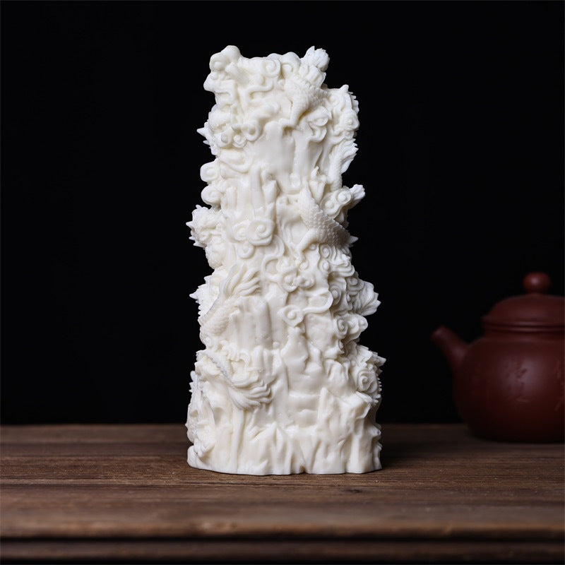 Rear and side view of Nine Dragon Guanyin vegetable ivory statue with cloud and dragon carving