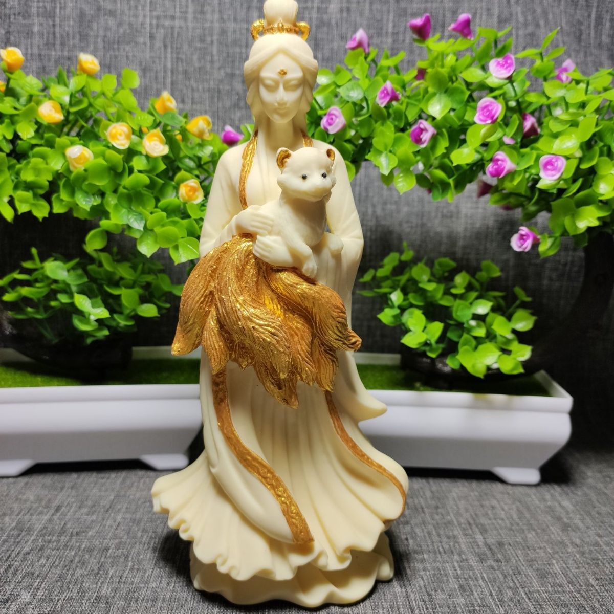 Ivory nut fox maiden statue in Chinese-style flowing robes with sculpted fox tails