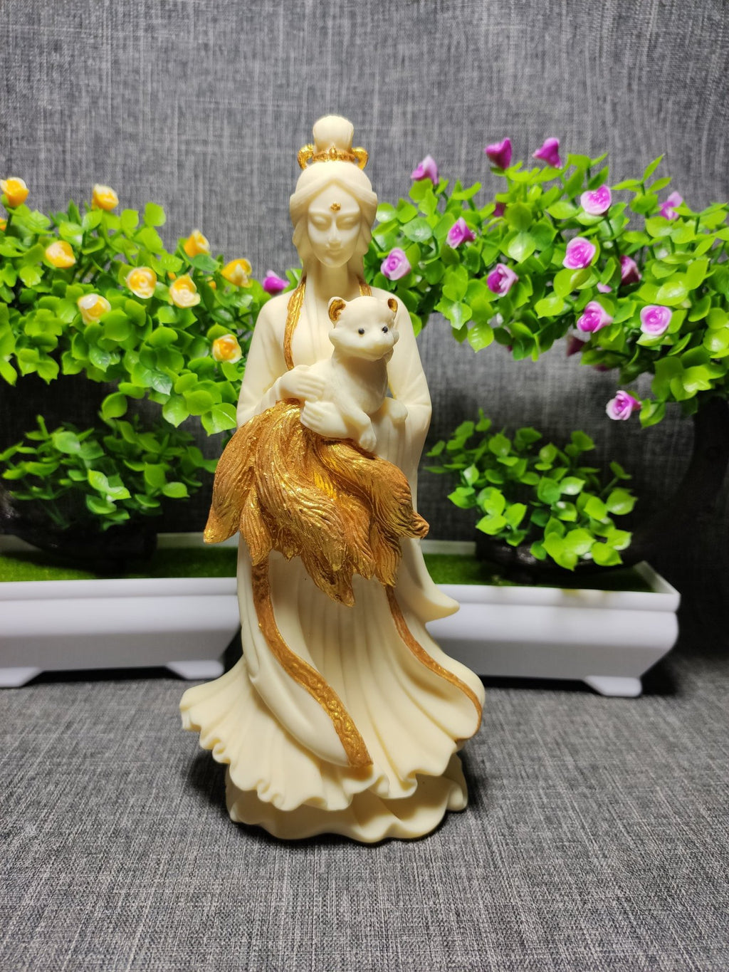 Ivory nut nine-tail fox maiden figurine with gold-tone accents and fox companion