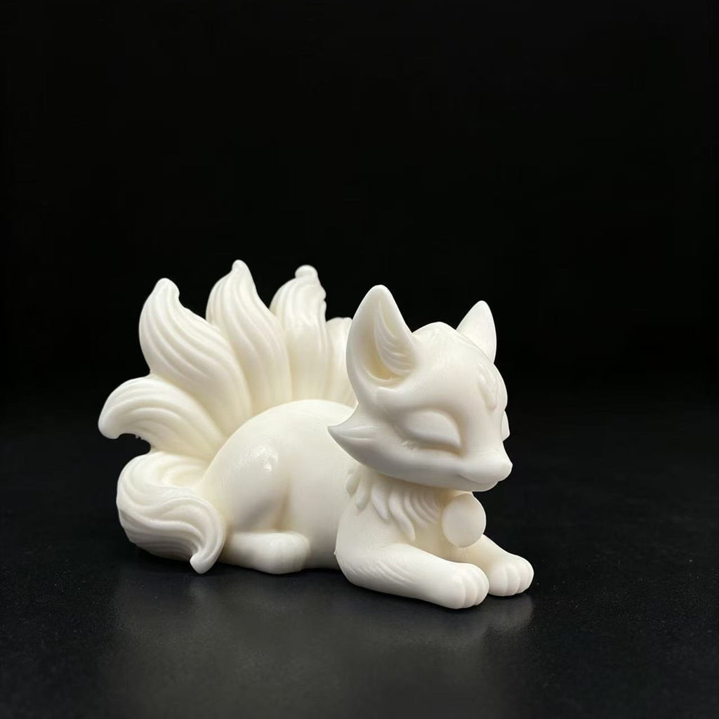 Natural ivory nut nine-tail fox figurine in creamy vegetable ivory tone shown from the side