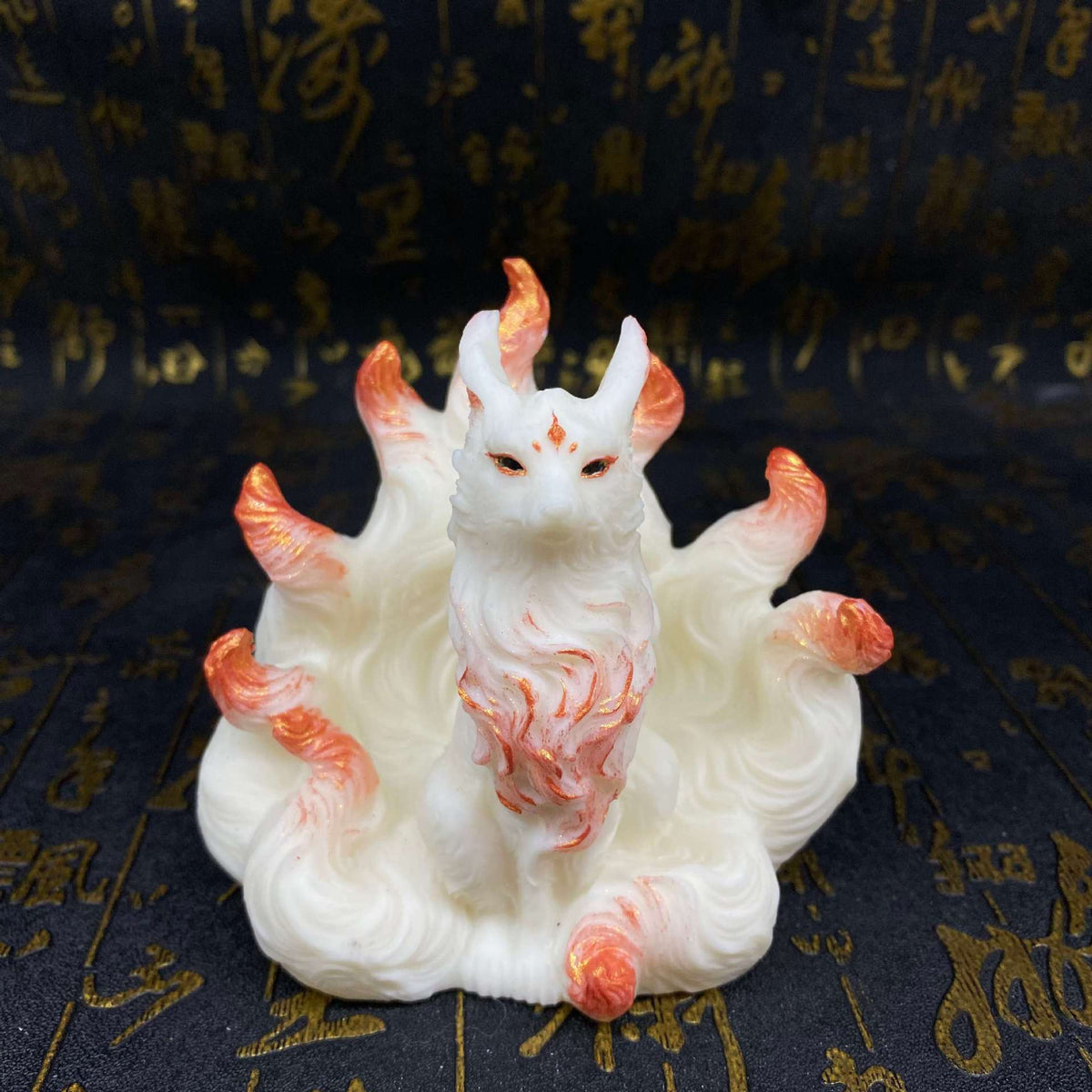 Ivory nut nine-tail fox figurine with rose-gold accents and flowing sculpted tails