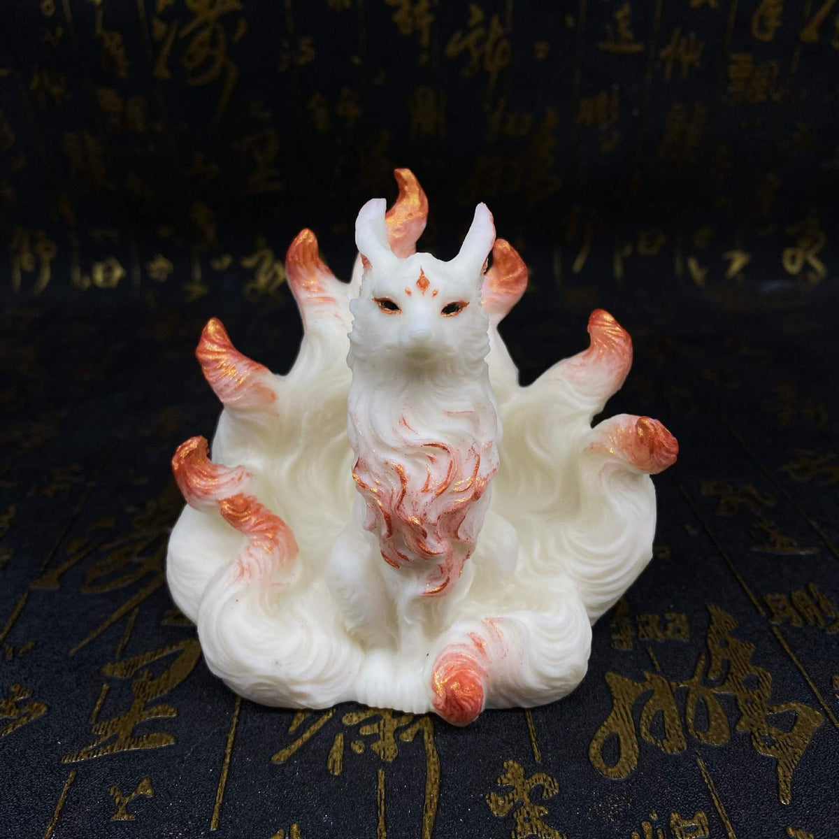 Ivory nut nine-tail fox figurine with rose-gold accent tails and chest details