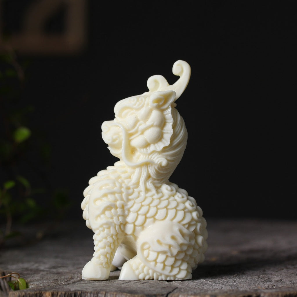 Ivory nut Qilin decorative ornament three-quarter view with detailed mane and scales