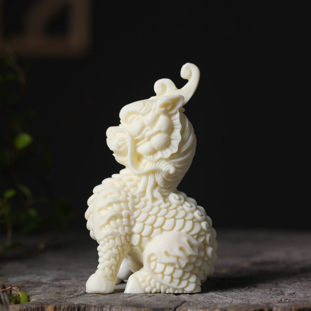 Ivory nut Qilin decorative ornament three-quarter view with detailed mane and scales