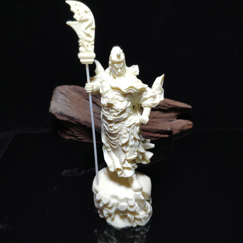 Standing Guan Yu ivory nut statue with guandao on decorative base, natural creamy finish