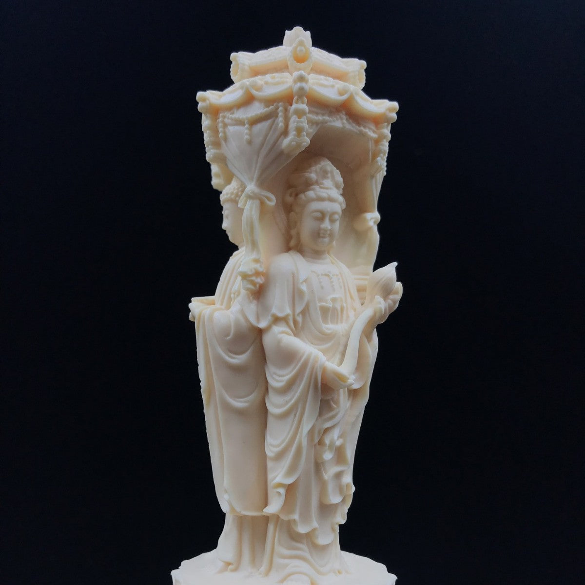 Ivory nut Western Three Saints pagoda-style Buddhist decorative carving with standing figures and canopy