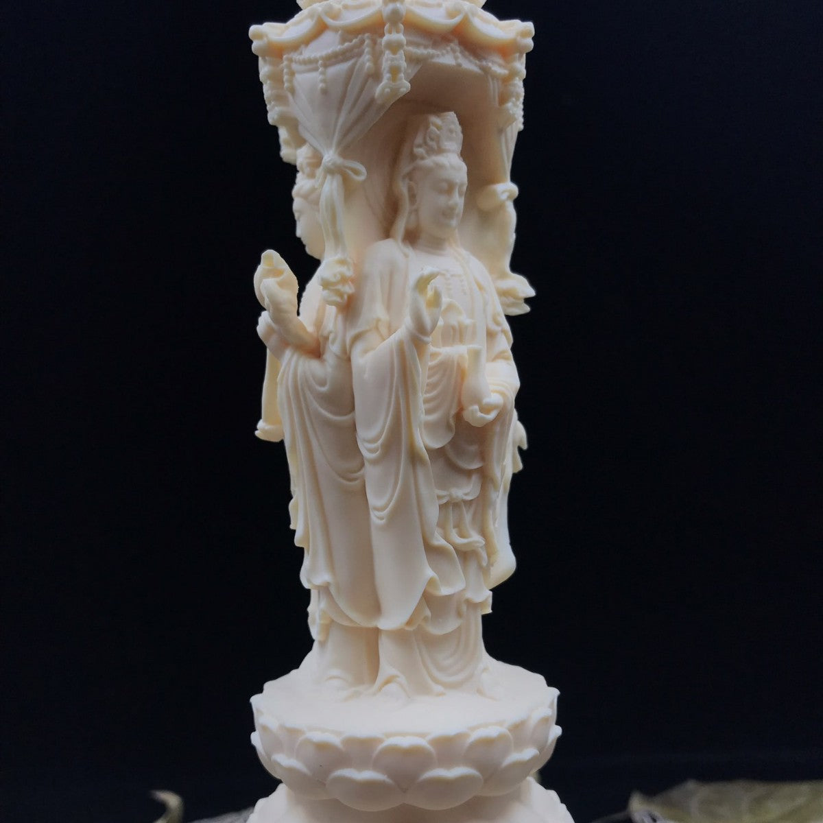 Ivory nut Amitabha triad pagoda ornament with detailed robes, lotus base and canopy