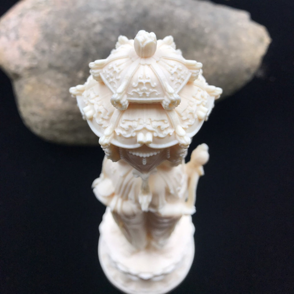 Ivory nut Western Three Saints decorative statue showing sculpted canopy and lotus base