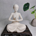 Ivory nut modern yoga woman figurine seated in prayer pose, front view