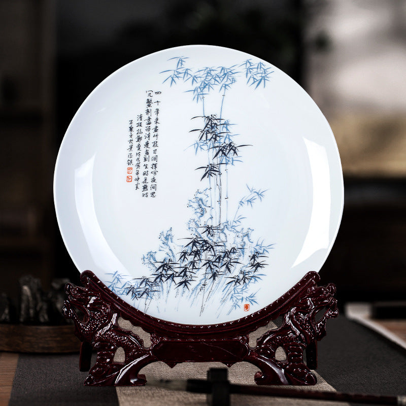 Traditional Chinese porcelain display plate with carved dragon stand