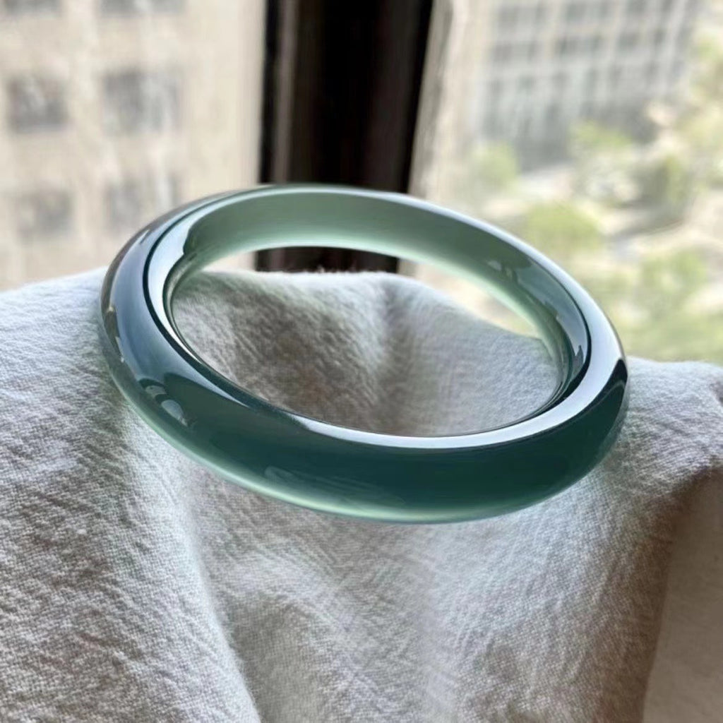 Kuli Blue chalcedony bangle with translucent blue-green polish