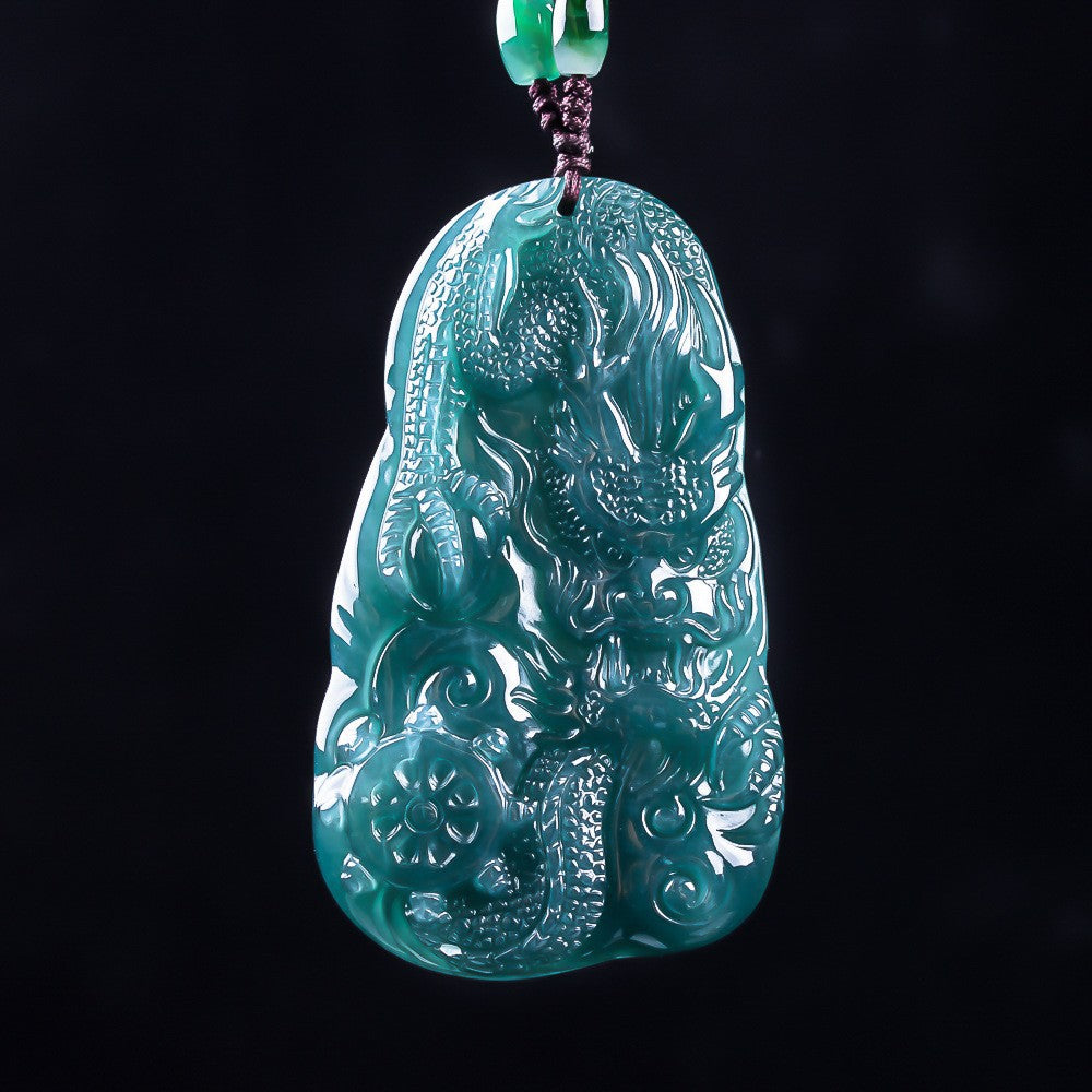 Natural Grade A jadeite dragon plaque showing deep carved scales and clouds