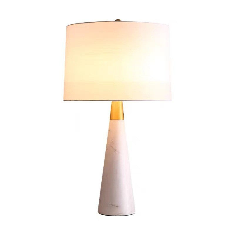 Large white marble tapered table lamp with brass accent and fabric shade