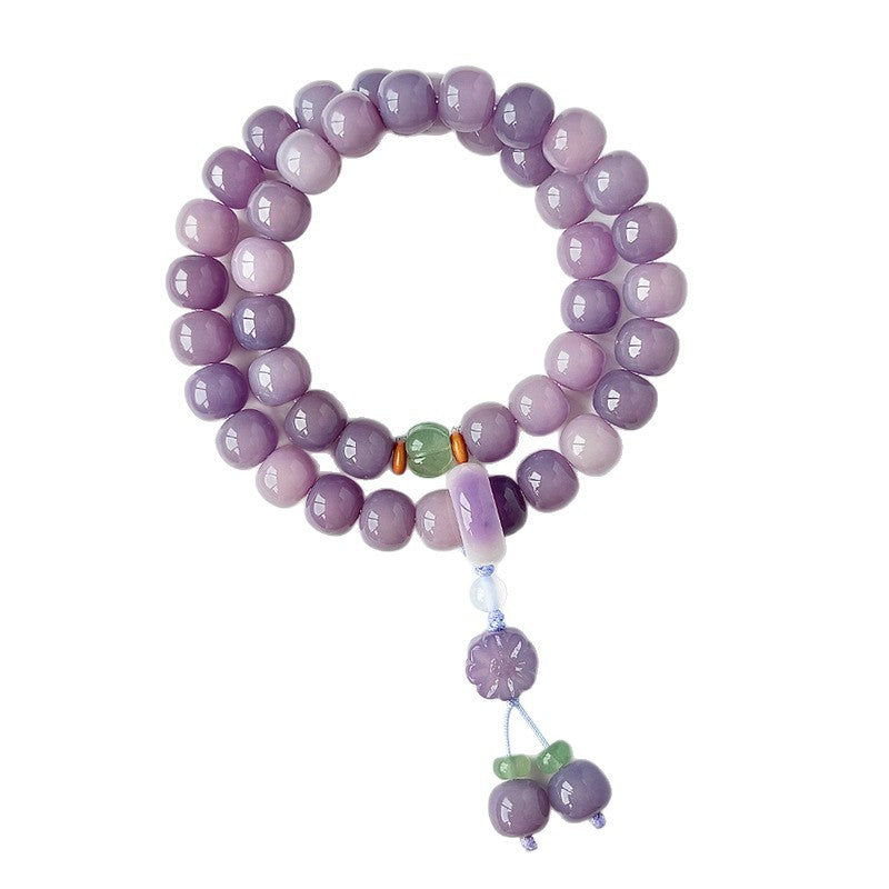 Lavender Bodhi root double-wrap wrist mala with flower motif tassel and pale green accents