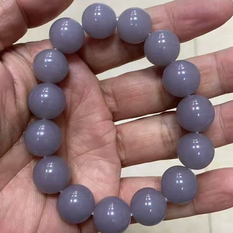 Large lavender grey round bead bracelet held in hand
