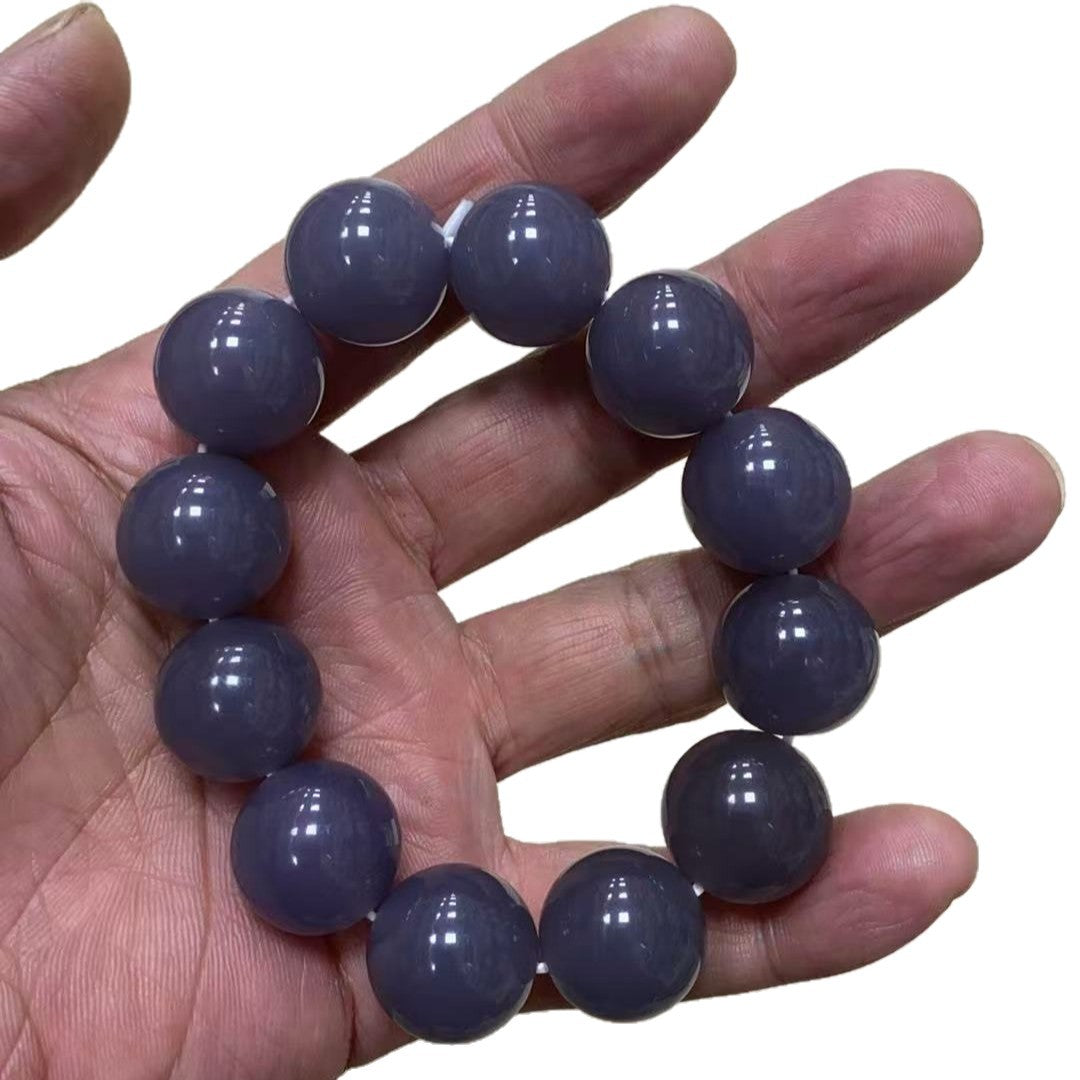 Polished grey violet bead bracelet on neutral background