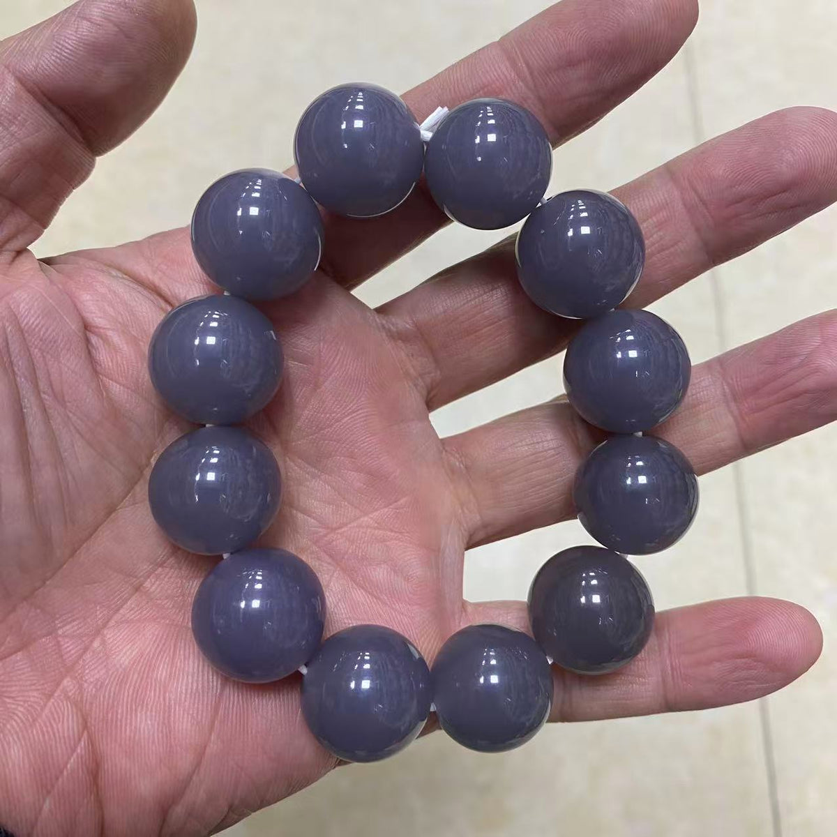 Large lavender grey stone beads on wrist