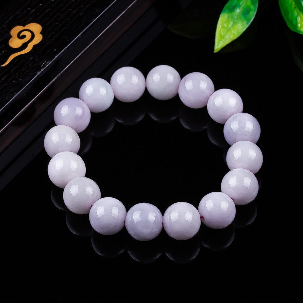 Polished lavender jadeite 14 mm beads showing soft lilac mineral tone