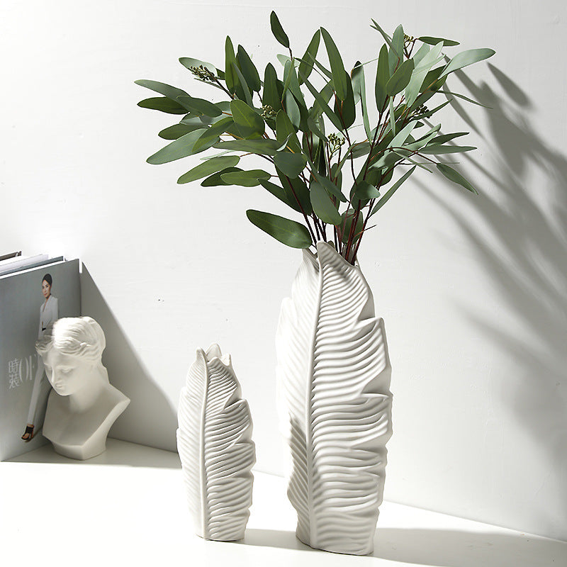 White textured leaf vase styled with eucalyptus branches
