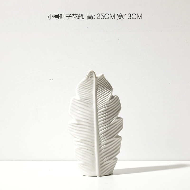 Organic white leaf form vase with ribbed botanical texture