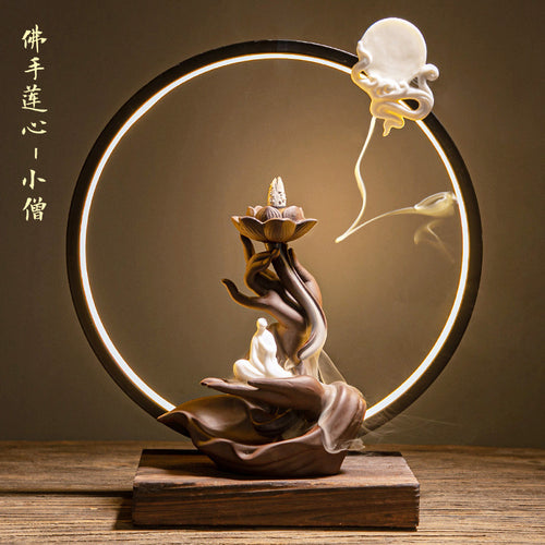 Circular LED Buddha hand incense display with seated figure