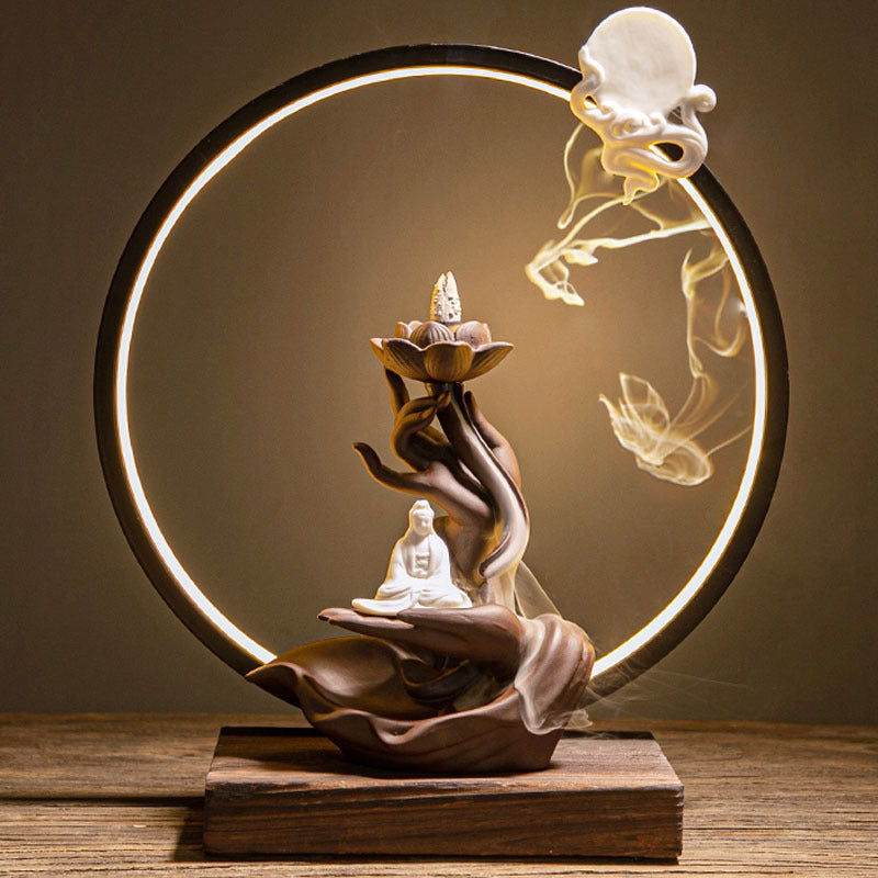 Buddha figure incense burner inside illuminated circular halo frame