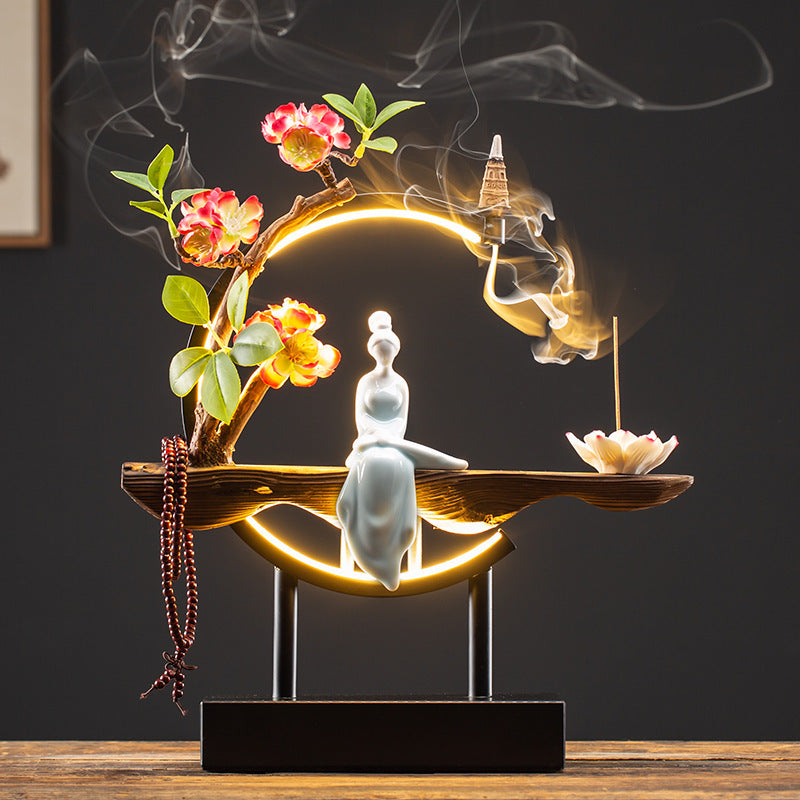 Illuminated circular Chinese lady incense display with blossoms and smoke