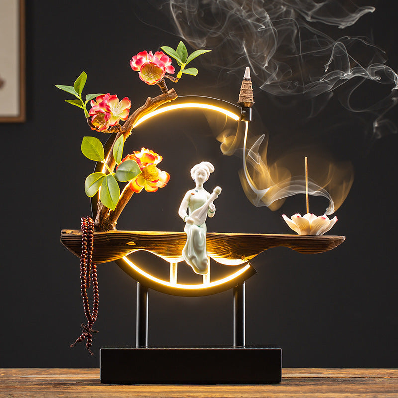 Seated Chinese beauty LED incense ornament with red blossoms and lotus tray