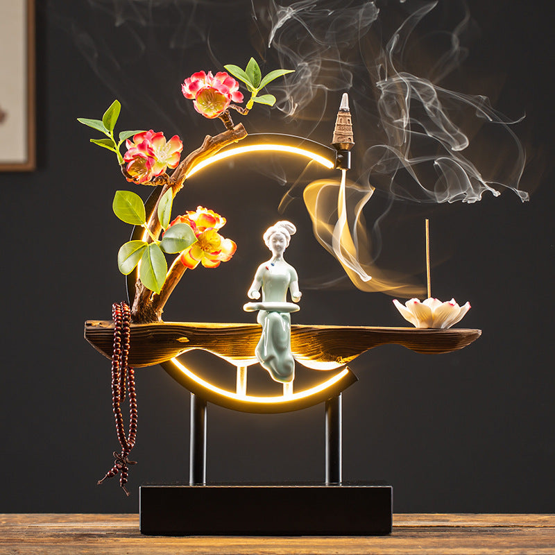 Warm LED circular incense display with Chinese lady and decorative blossoms