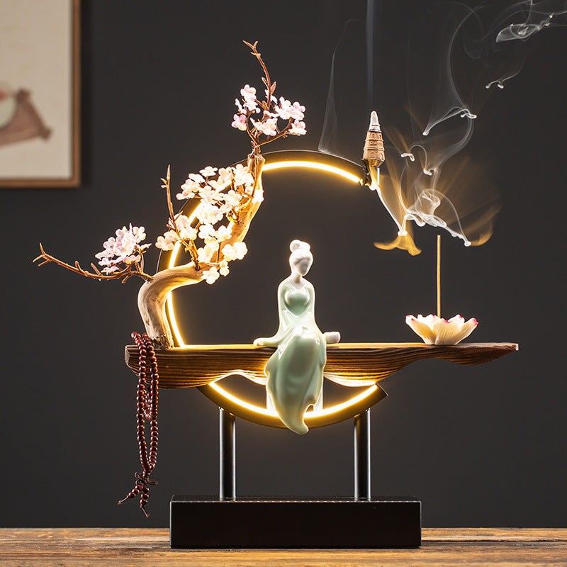 Plum blossom ring-light incense ornament with seated lady and lotus incense tray