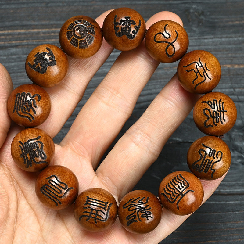 Polished brown Lei Ji Zao-style wood bead bracelet with engraved Taoist scripture-style symbols
