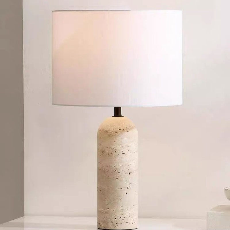 Light marble capsule table lamp with white drum shade front view