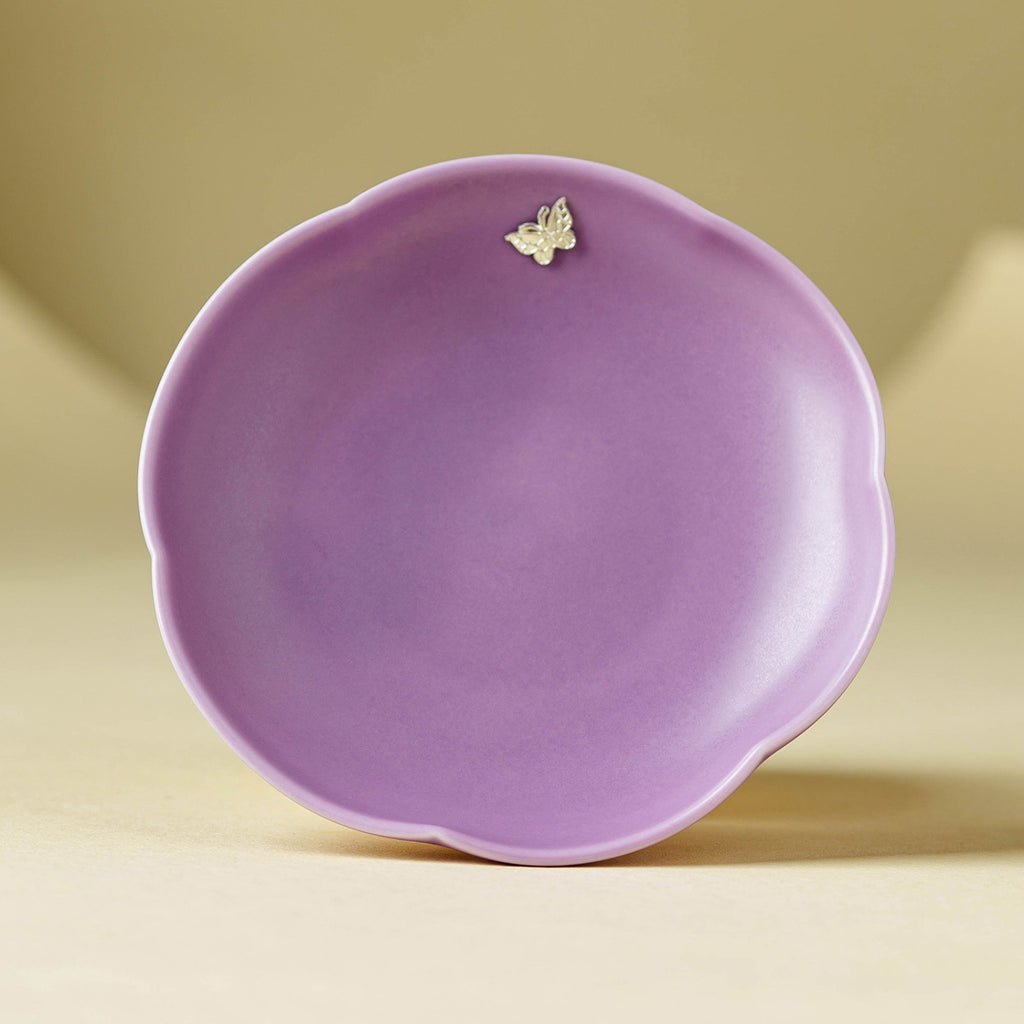 Handheld lilac purple ceramic pot bearer showing 12.2cm scale and butterfly accent