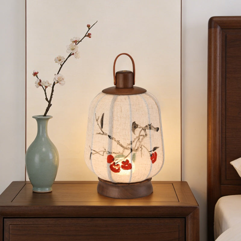 Persimmon lantern lamp on bedside cabinet with ceramic vase